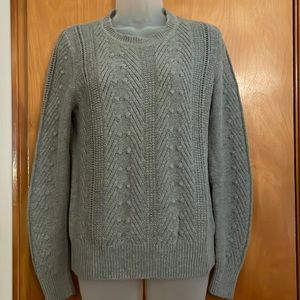 Grey knitted sweater with popcorn stitch front and sleeves